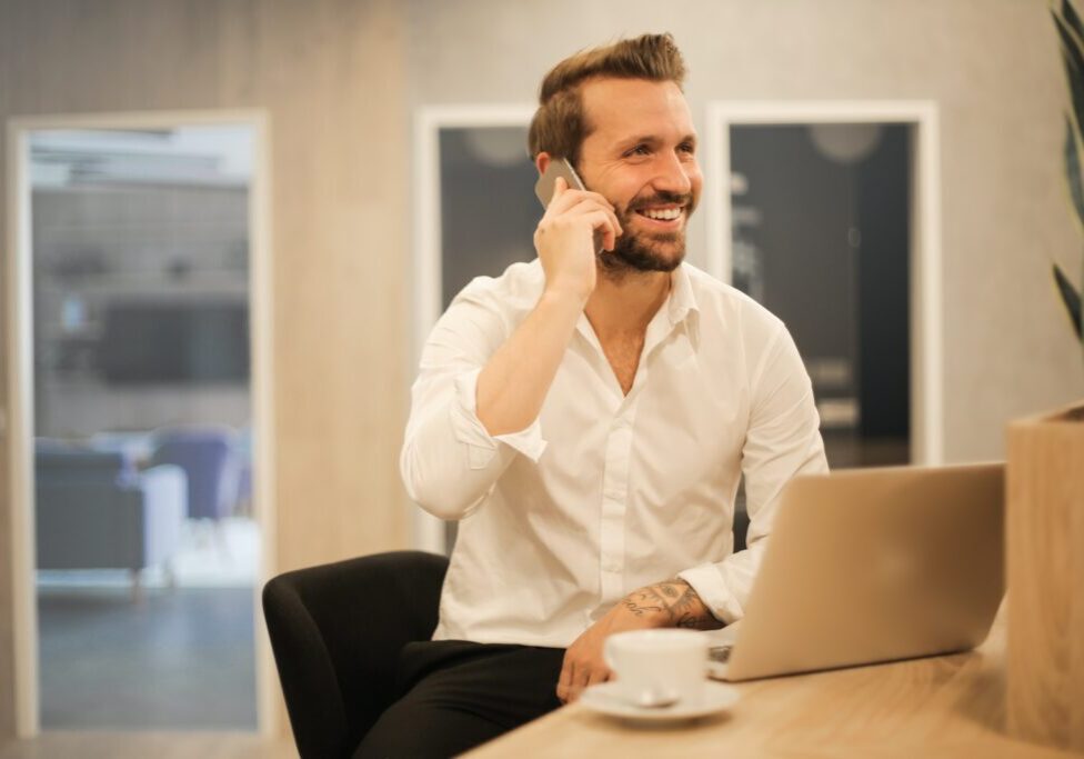 man using smartphone on chair